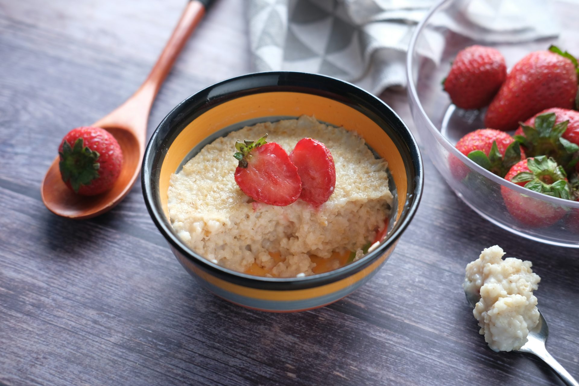 Creamy porridge bowl topped with fresh strawberries