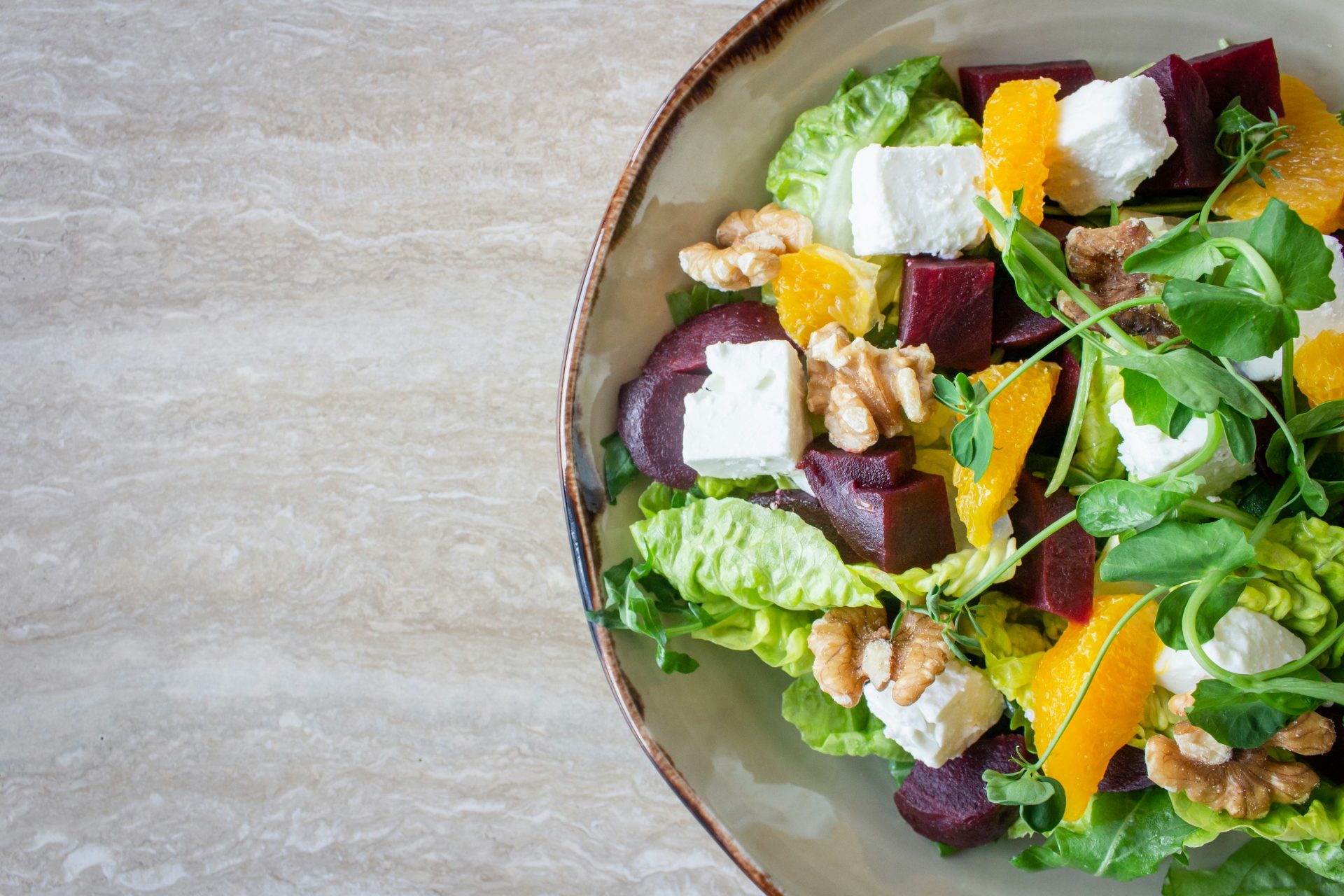 Vibrant salad with feta, walnuts, and orange slices